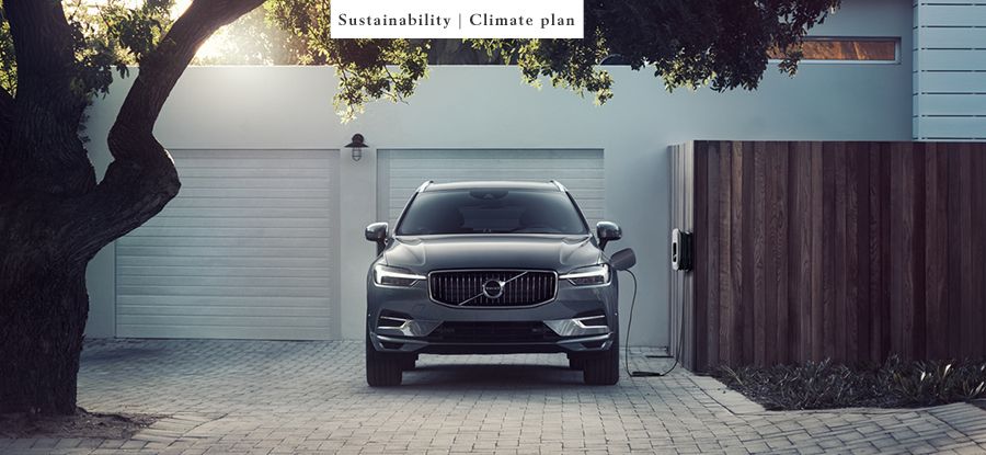 Photo of Volvo BEV charging in front of garage